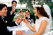 couple toasting at outdoor reception