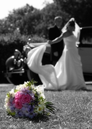 bride and groom dramatic photo with wedding bouquet