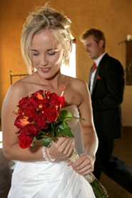 bride and groom with wedding bouquet inside church
