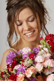 young bride with floral arrangement