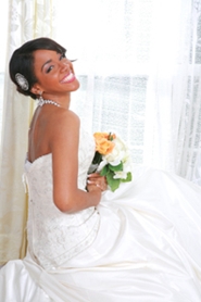 lovely young bride posing in her wedding gown