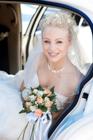 lovely young bride in back seat of limousine